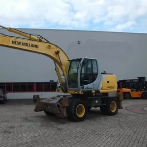 NEW HOLLAND MH5.6-колесный экскаватор.